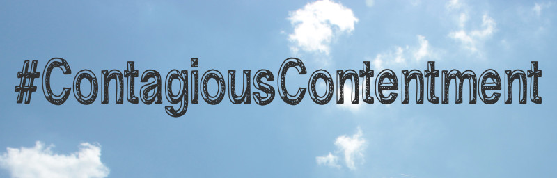 A pale blue sky with wisps of clouds is overlaid with text: #ContagiousContentment.