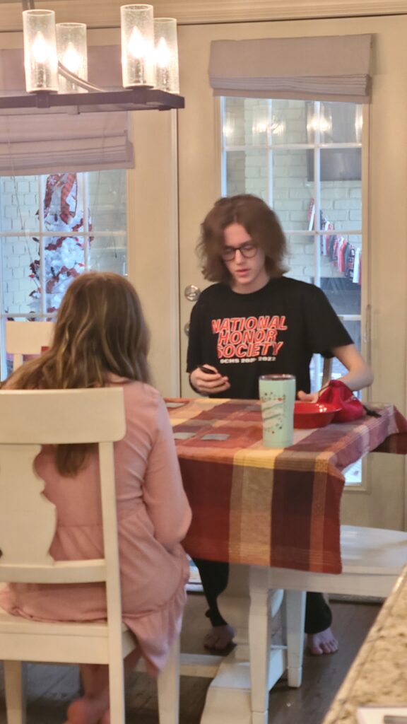 Sunday rest for my older kids is card games while the soup simmers.