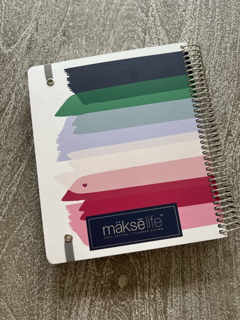 On the back of the cover, a blue rectangle includes the brand logo in silver embossing.
2024 Makselife planner review.